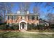 Brick two-story house with a charming front yard and walkway at 3821 Silver Bell Dr, Charlotte, NC 28211