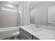 Modern bathroom with sleek vanity, tub and shower combination, and tiled walls at 4005 Grace Pointe Dr # 100, Wesley Chapel, NC 28079