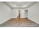 An open bedroom showcases a walk-in closet and an adjacent bathroom at 4005 Grace Pointe Dr # 100, Wesley Chapel, NC 28079