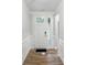 Bright entryway featuring wood floors, modern trim, and a paneled front door with sidelight at 4005 Grace Pointe Dr # 100, Wesley Chapel, NC 28079