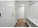 Inviting entryway features durable wood-look floors and a convenient bench with coat hooks at 4005 Grace Pointe Dr # 100, Wesley Chapel, NC 28079