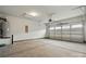 Spacious garage offers ample room for parking and storage with an automatic door opener at 4005 Grace Pointe Dr # 100, Wesley Chapel, NC 28079