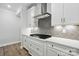 Modern kitchen with stainless steel range, quartz countertops, and ample cabinetry at 4005 Grace Pointe Dr # 100, Wesley Chapel, NC 28079