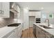 Well-appointed kitchen with quartz countertops, stainless appliances, and a decorative backsplash at 4005 Grace Pointe Dr # 100, Wesley Chapel, NC 28079