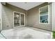 Covered patio with sliding glass door access at 4005 Grace Pointe Dr # 100, Wesley Chapel, NC 28079