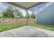 Spacious covered patio overlooking backyard at 4005 Grace Pointe Dr # 100, Wesley Chapel, NC 28079