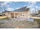 Backyard patio with covered area, ramp access and two chairs at 409 Chinaberry Dr, China Grove, NC 28023