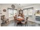 Bright dining area with wood table and access to backyard at 409 Chinaberry Dr, China Grove, NC 28023