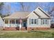 One story house with a green door and white porch at 409 Chinaberry Dr, China Grove, NC 28023