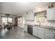 Kitchen features granite countertops and stainless steel dishwasher at 409 Chinaberry Dr, China Grove, NC 28023