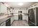 Modern kitchen with stainless steel appliances and granite countertops at 409 Chinaberry Dr, China Grove, NC 28023