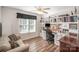 Home office with built-in shelving, desk, and seating at 409 Chinaberry Dr, China Grove, NC 28023