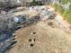 Aerial view of property showcasing house and outbuildings at 41943 Gurley Rd, New London, NC 28127