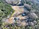 Aerial view of property with house and outbuildings at 41943 Gurley Rd, New London, NC 28127