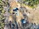 Aerial view showing a house, sheds, and a long driveway at 41943 Gurley Rd, New London, NC 28127