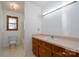 Bathroom with tub/shower combo, vanity, and tile floor at 41943 Gurley Rd, New London, NC 28127