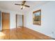 Bedroom with hardwood floors, ceiling fan and access to closet at 41943 Gurley Rd, New London, NC 28127