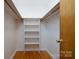 Large closet with hanging rods and shelving for ample storage at 41943 Gurley Rd, New London, NC 28127