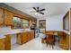 Kitchen with wood cabinets, built-in bench, and views of the backyard at 41943 Gurley Rd, New London, NC 28127