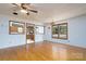 Large living room with hardwood floors and open kitchen views at 41943 Gurley Rd, New London, NC 28127