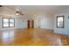 Spacious living room with hardwood floors and two ceiling fans at 41943 Gurley Rd, New London, NC 28127