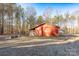 Red storage shed in backyard at 41943 Gurley Rd, New London, NC 28127