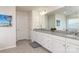 Elegant bathroom with double vanity, granite countertop, and large mirror at 4479 Dover Ct, Denver, NC 28037