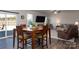 Bright dining area with wooden table and chairs, near sliding doors to backyard at 4479 Dover Ct, Denver, NC 28037