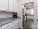 White cabinets and granite countertops in kitchen at 4479 Dover Ct, Denver, NC 28037