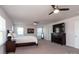 Large main bedroom with a king-size bed, dresser, and ceiling fan at 4479 Dover Ct, Denver, NC 28037