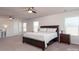 Spacious main bedroom with king-size bed and plenty of natural light at 4479 Dover Ct, Denver, NC 28037