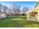 Spacious backyard with shed and covered patio at 4649 Maple Crest Pl, Harrisburg, NC 28075