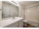 Clean bathroom featuring a bathtub, vanity, and mirror at 4649 Maple Crest Pl, Harrisburg, NC 28075