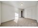 Bright bedroom with neutral carpeting and ample closet space at 4649 Maple Crest Pl, Harrisburg, NC 28075