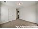 Well-lit bedroom with closet and access to hallway at 4649 Maple Crest Pl, Harrisburg, NC 28075