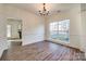 Formal dining room with chandelier and wood-look floors at 4649 Maple Crest Pl, Harrisburg, NC 28075