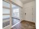 Bright entryway with wood-look floors and sliding glass doors at 4649 Maple Crest Pl, Harrisburg, NC 28075