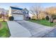 Two-story home with attached garage and driveway at 4649 Maple Crest Pl, Harrisburg, NC 28075