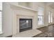 Elegant fireplace with a white mantel and marble surround at 4649 Maple Crest Pl, Harrisburg, NC 28075