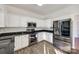 Kitchen with white cabinets, granite countertops, and stainless steel appliances at 4649 Maple Crest Pl, Harrisburg, NC 28075