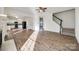 Open living area with hardwood floors and views into the kitchen at 4649 Maple Crest Pl, Harrisburg, NC 28075