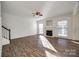 Living room with hardwood floors, fireplace, and lots of natural light at 4649 Maple Crest Pl, Harrisburg, NC 28075