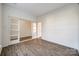 Empty spare bedroom with wood-look floors and white walls at 4649 Maple Crest Pl, Harrisburg, NC 28075