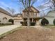 Two-story house with stone accents and a welcoming front porch at 5124 Craftsman Ridge Dr, Matthews, NC 28104