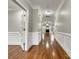 Elegant hallway with hardwood floors and wainscoting at 5124 Craftsman Ridge Dr, Matthews, NC 28104