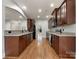 Kitchen with granite countertops and dark brown cabinets at 5124 Craftsman Ridge Dr, Matthews, NC 28104