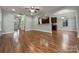 Open living room and kitchen with hardwood floors at 5124 Craftsman Ridge Dr, Matthews, NC 28104