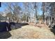 Large backyard with a wooden fence and plenty of trees at 5921 Marshbank Ln, Charlotte, NC 28269