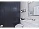 Modern powder room with dark-colored vertical shiplap and white vanity at 5921 Marshbank Ln, Charlotte, NC 28269