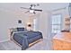 Spacious bedroom with a comfortable bed and built-in shelving at 5921 Marshbank Ln, Charlotte, NC 28269